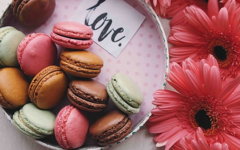 macaroons on a tray with the word 'love'